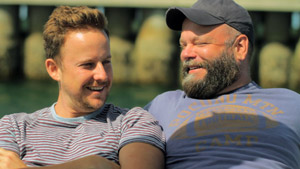 Film Still BEARCITY 2: THE PROPOSAL by director Doug Langway; bear couple Brian Keane and Stephen Guarino are sun bathing